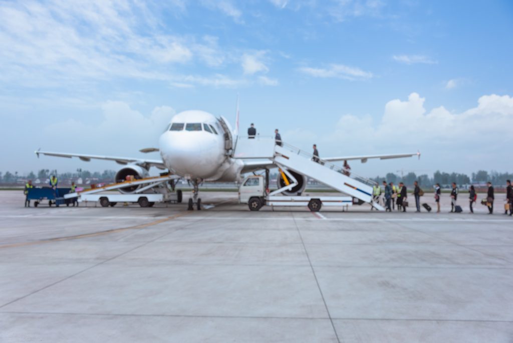 people-boarding-airplane-runway-min-min