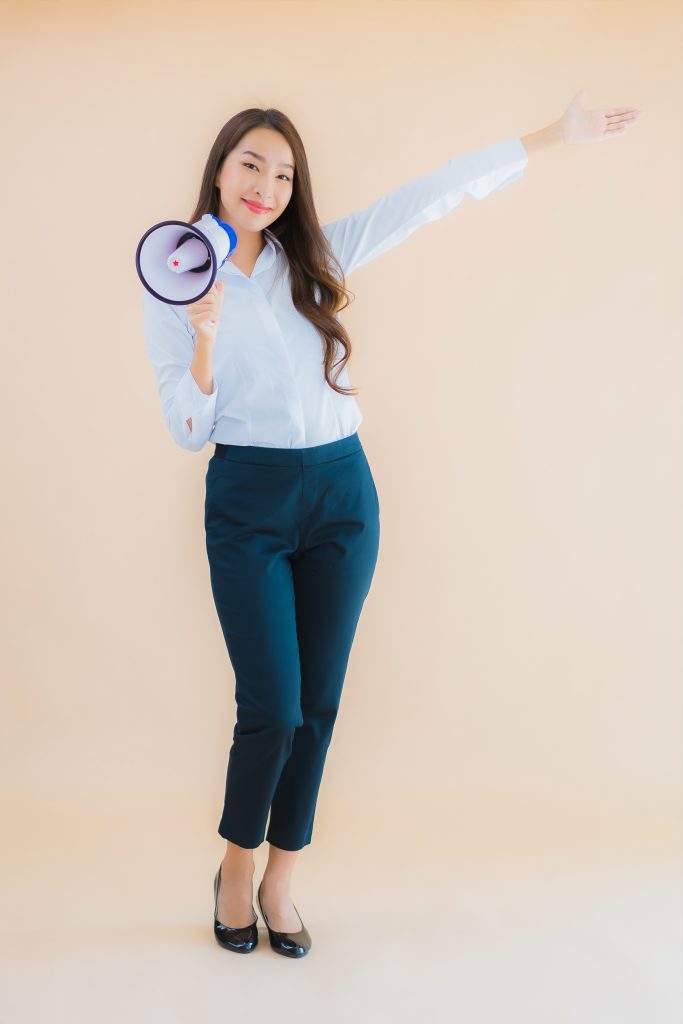 Portrait beautiful young asian business woman with megaphone