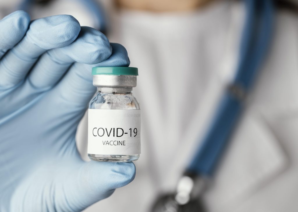 doctor-preparing-covid-19-vaccine-min