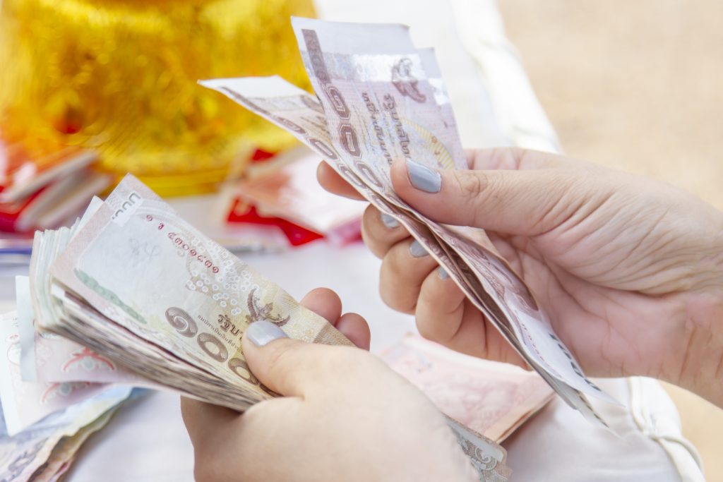 Hands counting of Thai baht notes money concept banknotes